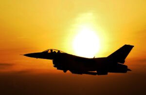 The Attitude of a fighter pilot. An F-16 at sunrise.