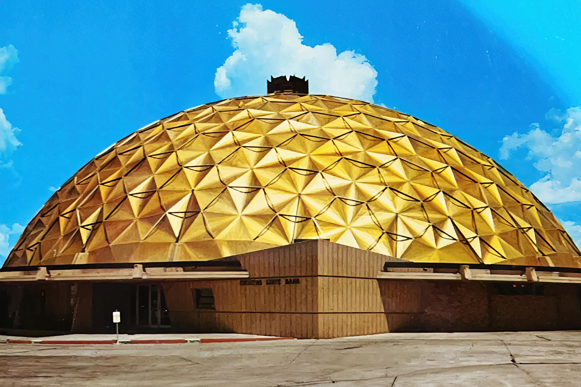 The gold dome bank with a blue sky behind it.