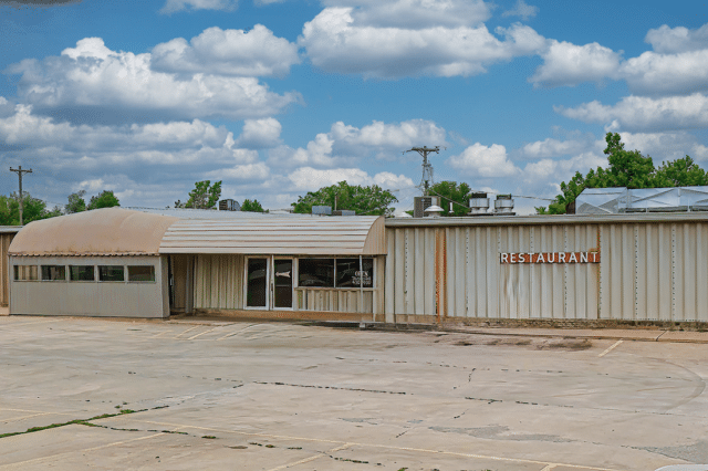 A Ken's Steaks and Ribs building with a sign.