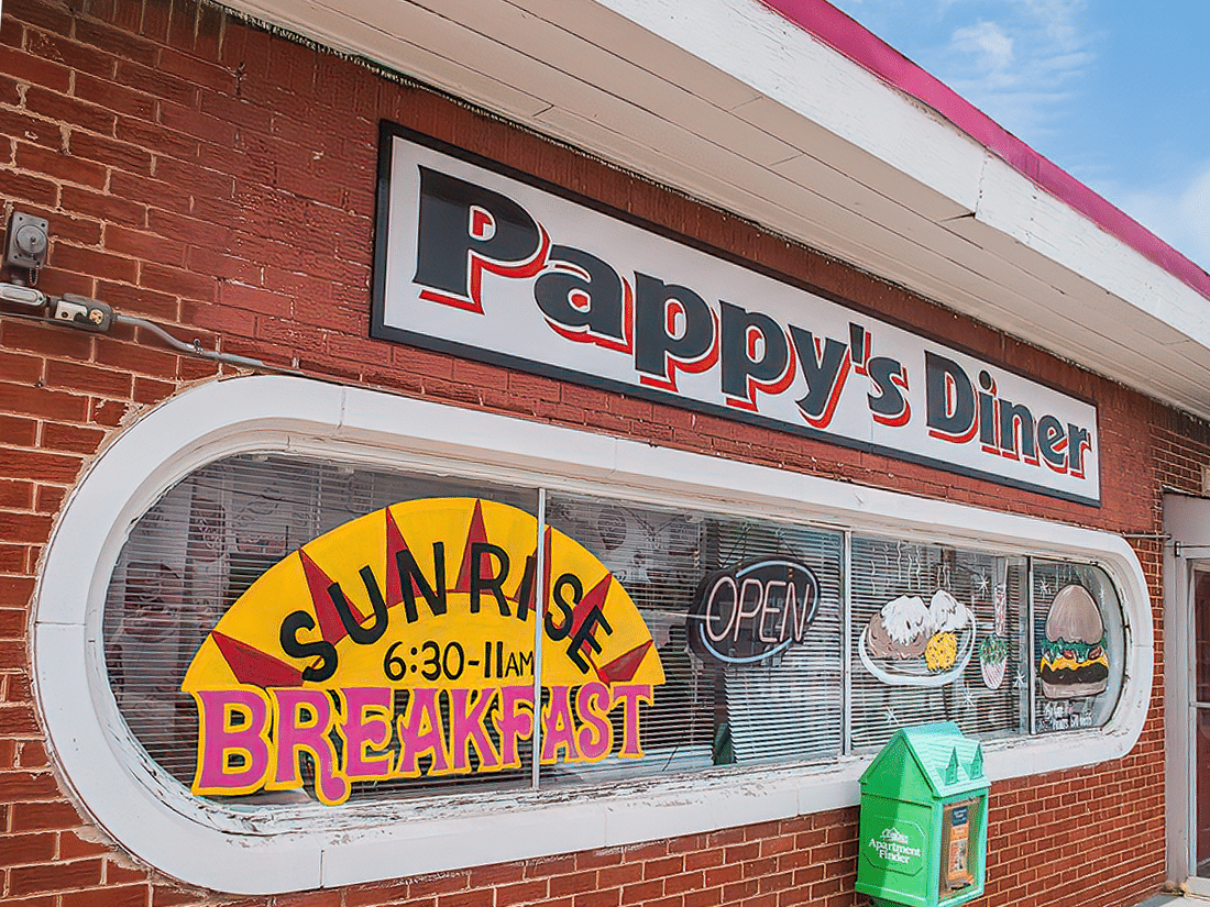 A brick building with a sign for pappy's diner.