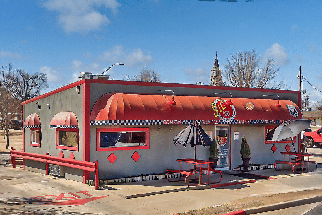 Sid's Diner with a red awning and umbrellas.